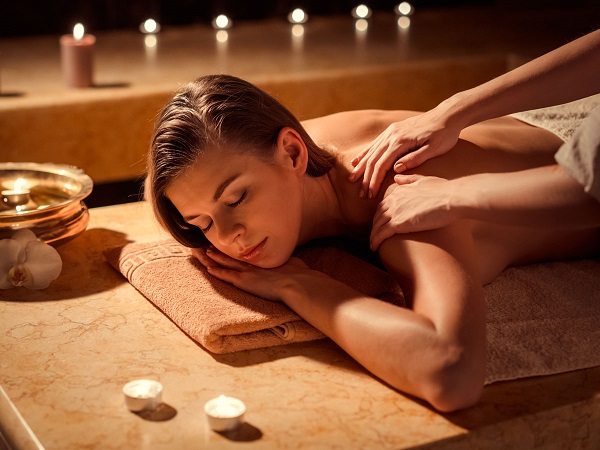 A Beautiful Image of a woman experiencing massage therapy.